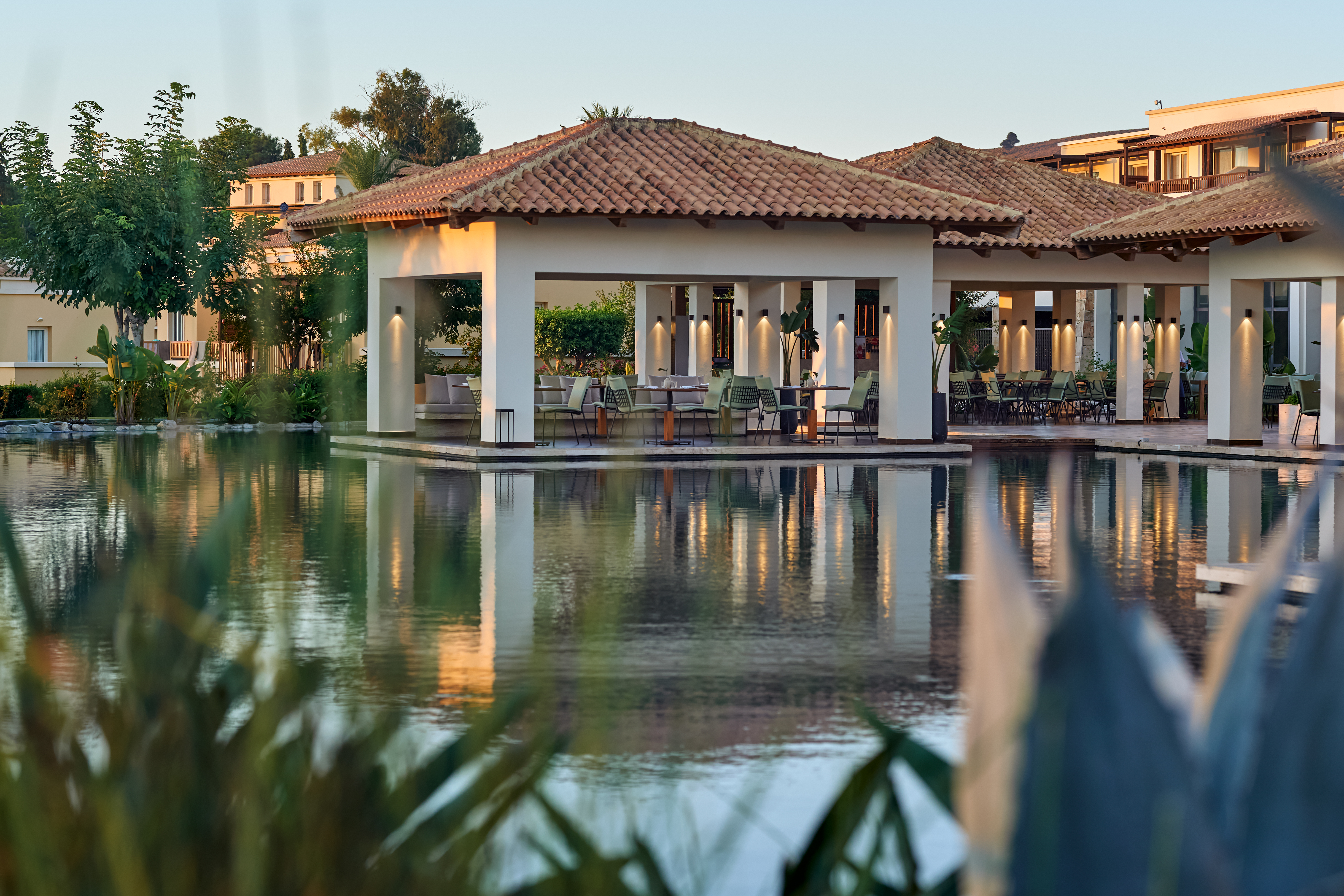 10-LUXME-KOS-surrounds-an-expansive-lagoon-framed-by-lush-tropical-landscapes-for-tranquil-views
