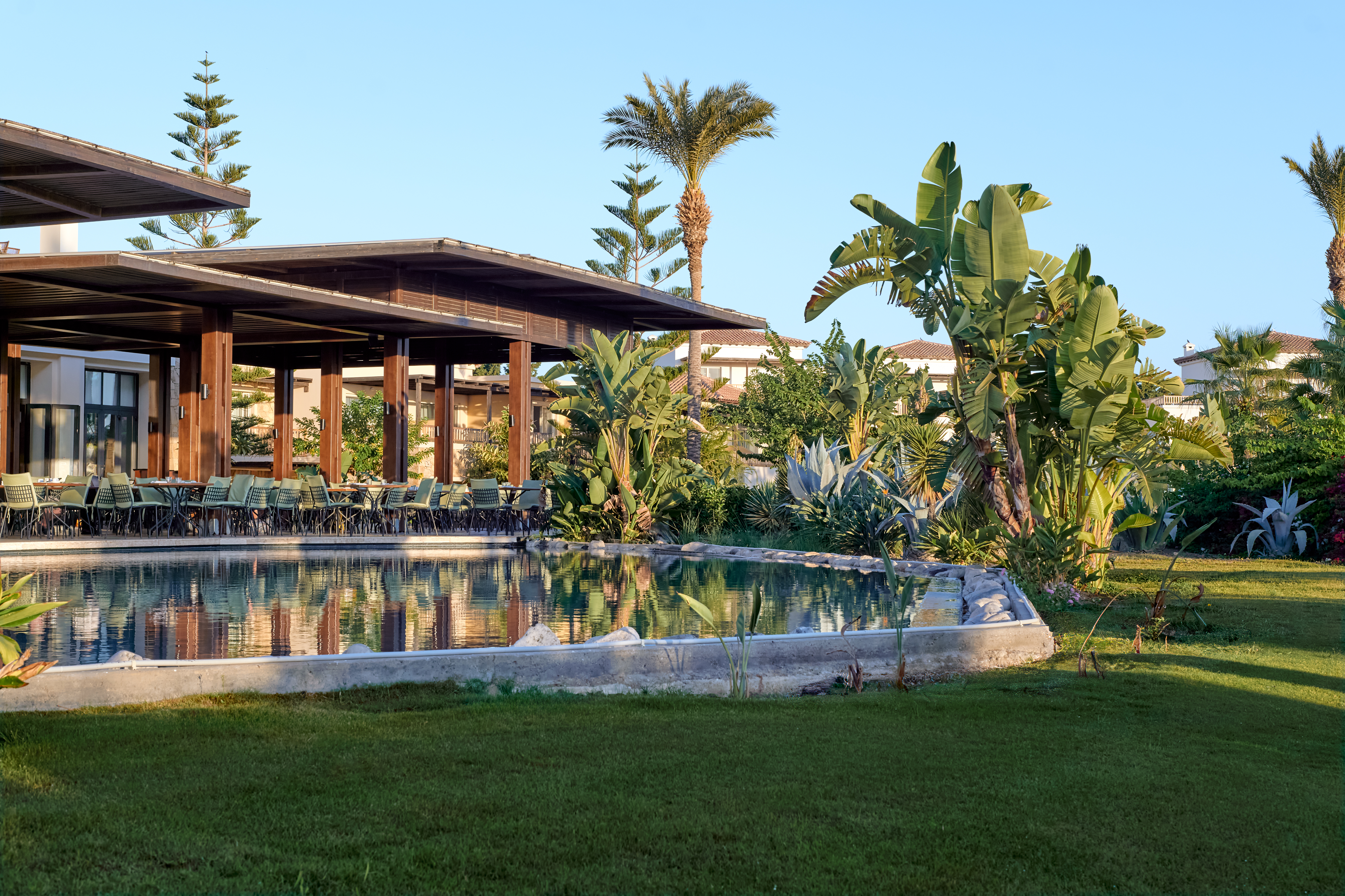 11-LUXME-KOS-exotic-gardens-cascading-to-the-beach-edge-for-picturesque-and-relaxing-views
