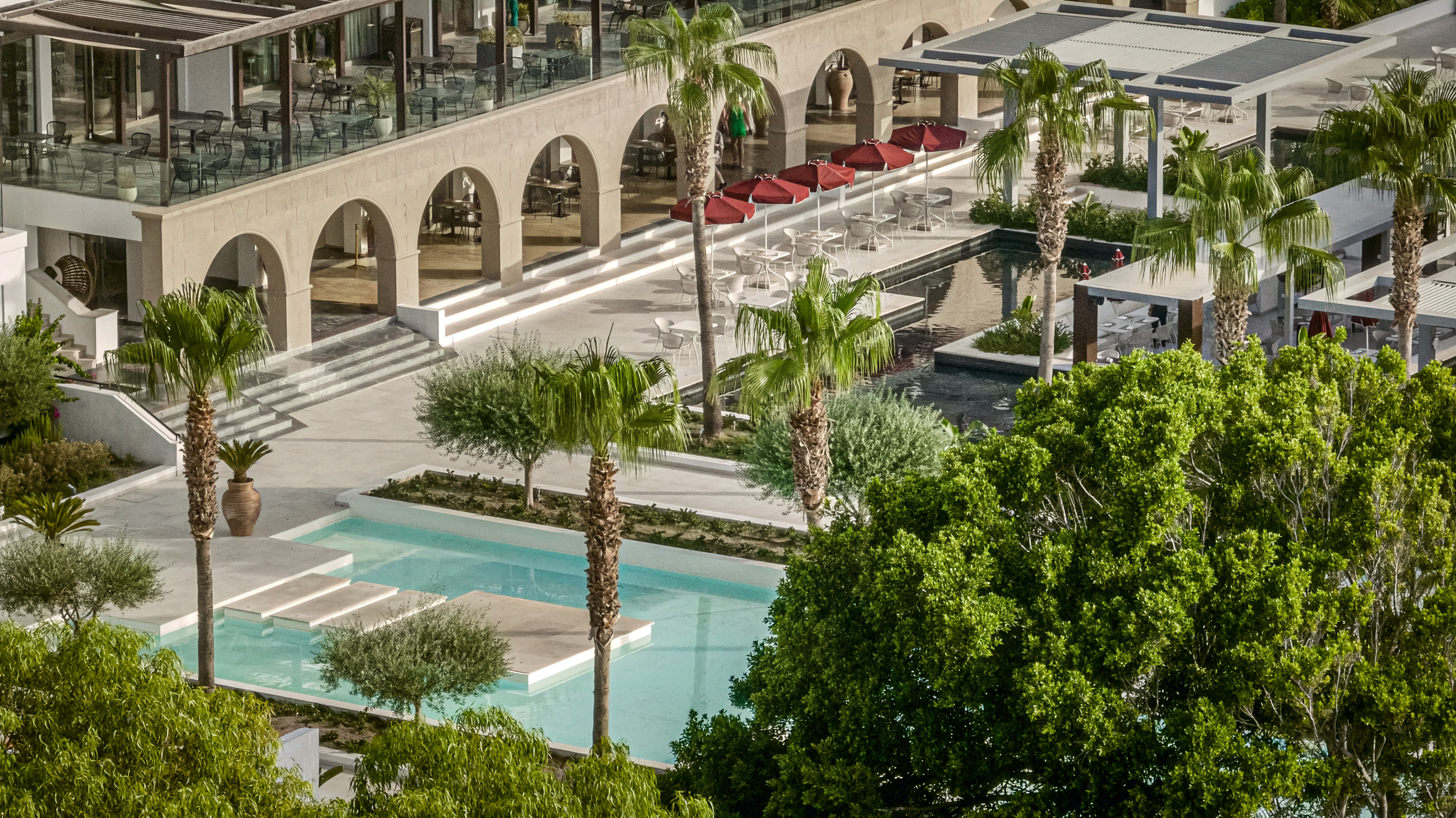 15-Dama-Dama-luxury-pool-surrounded-by-lush-gardens-for-relaxation-and-serenity